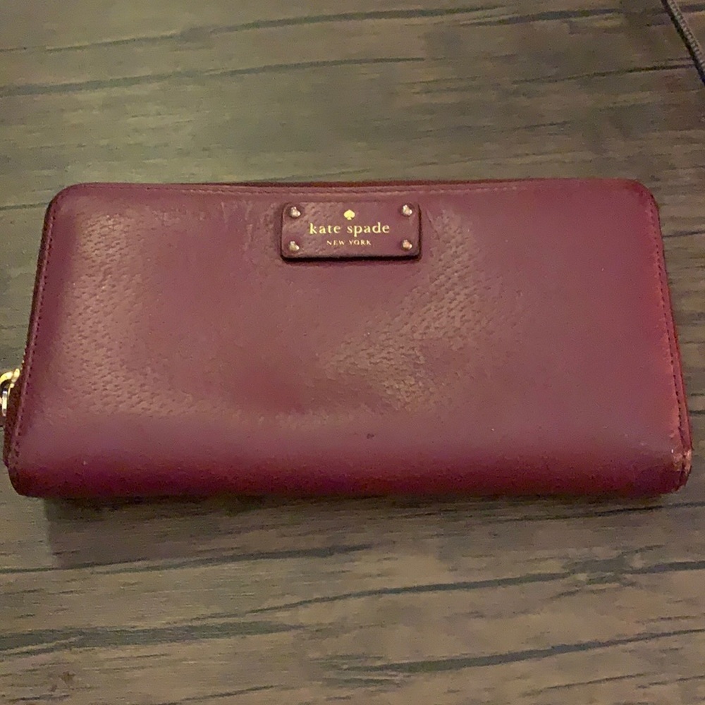 Kate Spade wine leather wallet in GUC